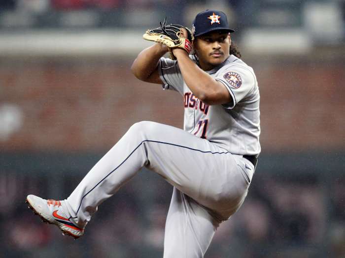 Oct 29, 2021; Atlanta, Georgia, USA; Houston Astros starting pitcher Luis Garcia (77) throws against the Atlanta Braves during the first inning during game three of the 2021 World Series at Truist Park.